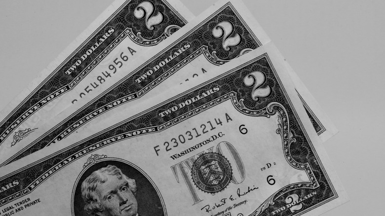 Three two dollar bills