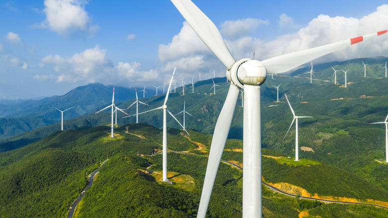 Aerial view of a wind farm with large turbines