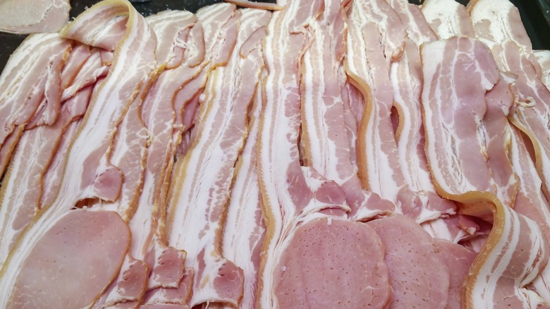 Many raw bacon strips on display