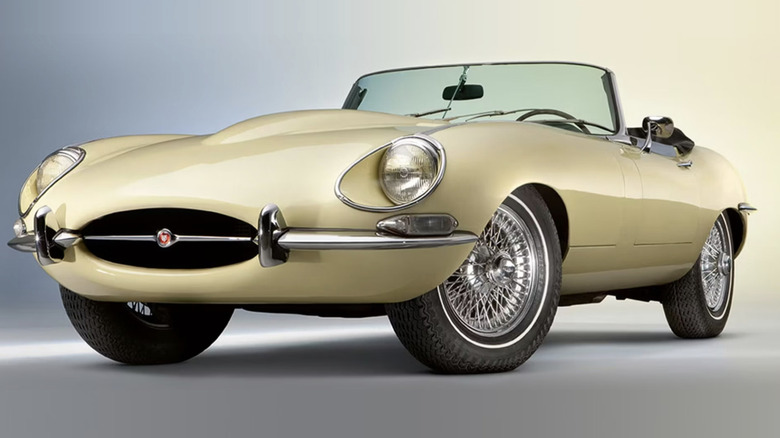 A yellow classic Jaguar convertible