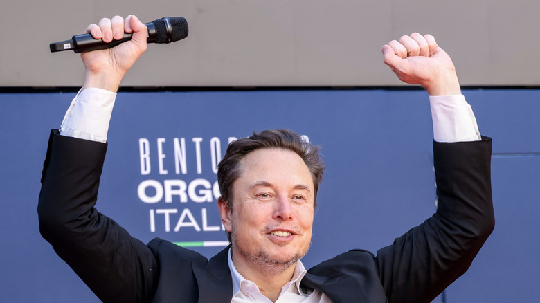 Elon Musk fist pumping on stage