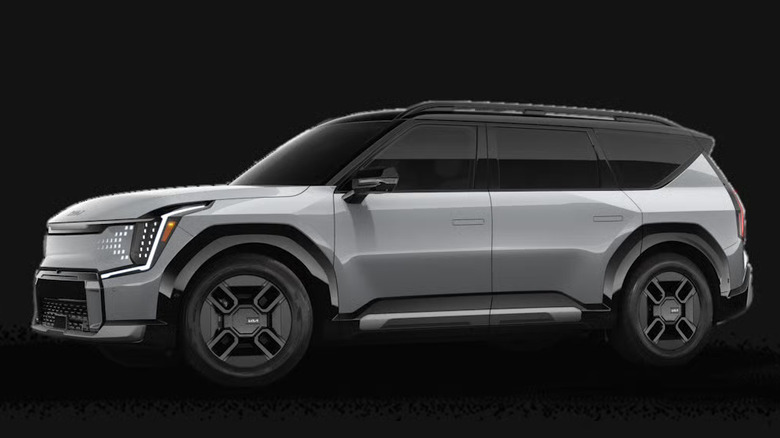 silver Kia EV9 against solid black background