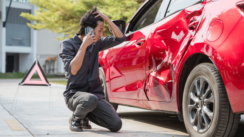 Man on the phone after a car accident