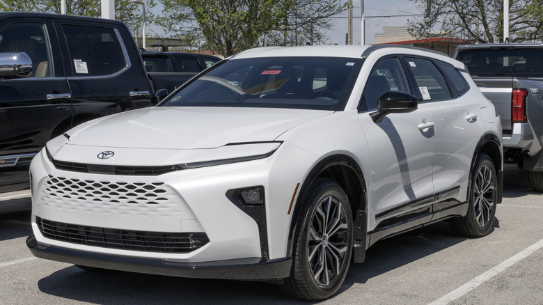 A white Toyota Crown Signia in a parking lot.