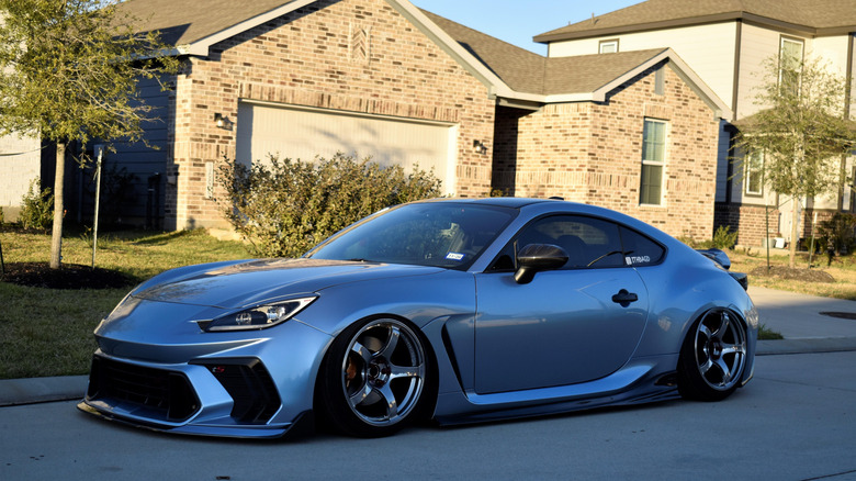 A Toyota GR86 parked on a street.