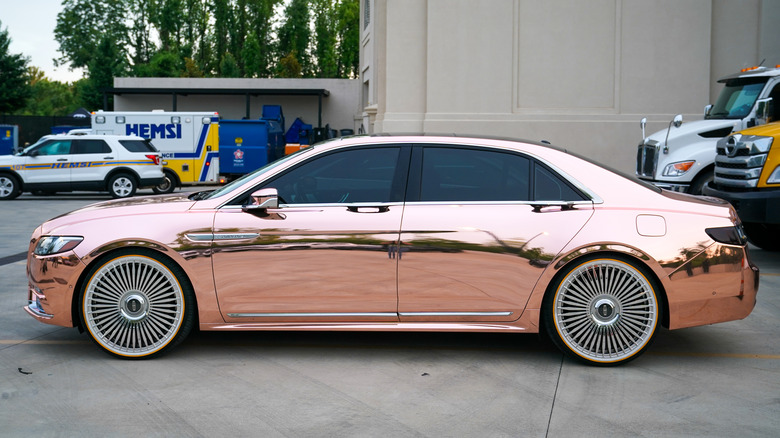 a sedan with a custom mirror-like paint job