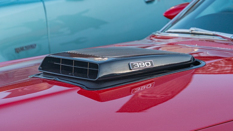 a hood air scoop on a red Mustang 390