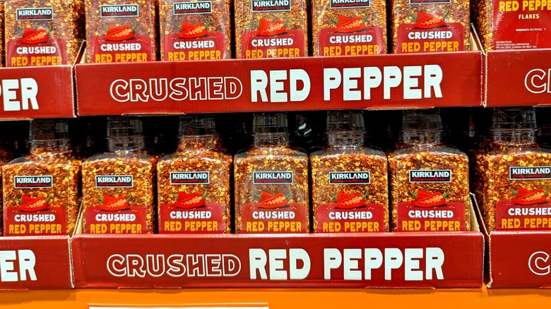 Bottles of Kirkland Signature Crushed Red Pepper Spice Seasoning Ingredient on Shelf at Warehouse