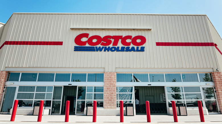 Exterior shot of a Costco Wholesale store at daytime with Costco Wholesale signage.