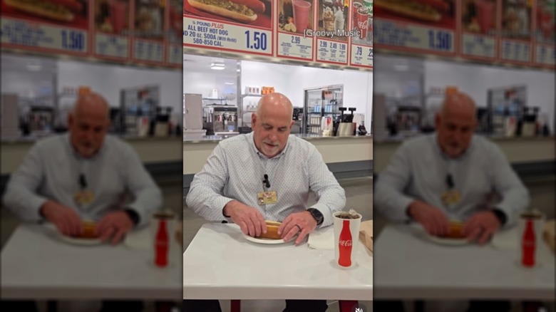 Costco CEO eating a hot dog