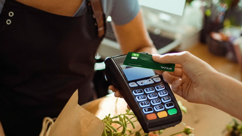close-up of TD Cash Credit Card being handed to cashier