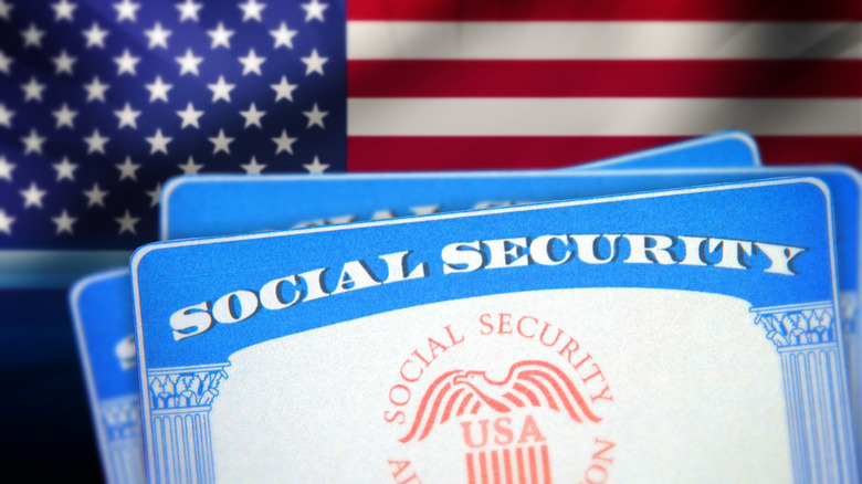 Social security cards with American flag in background