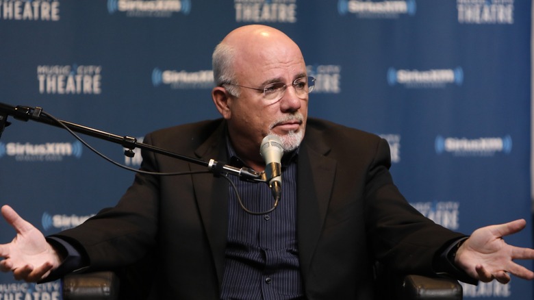 Dave Ramsey speaking and gesturing during a Sirius XM event.