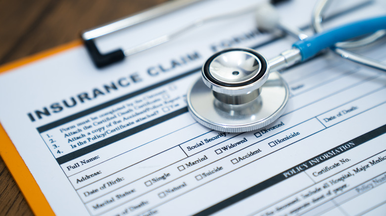 An insurance claim form with a stethoscope.
