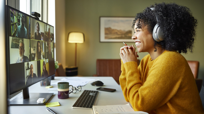 woman on a video call with colleagues at home