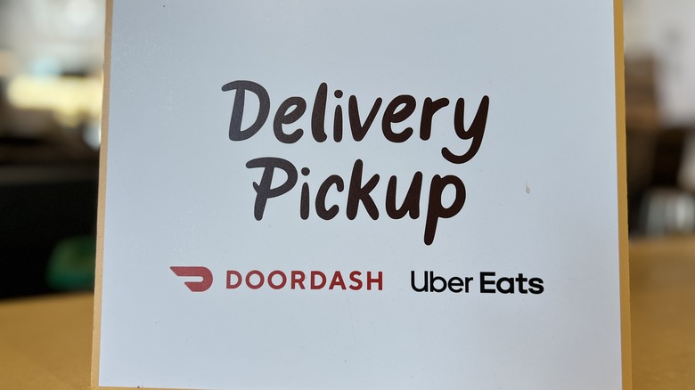 Sign for DoorDash and Uber Eats Delivery Pickup sign in Lafayette, California