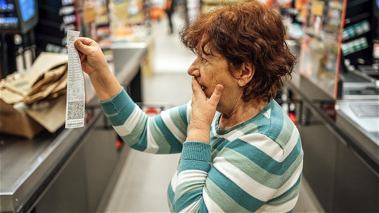 Person reacting to groceries total