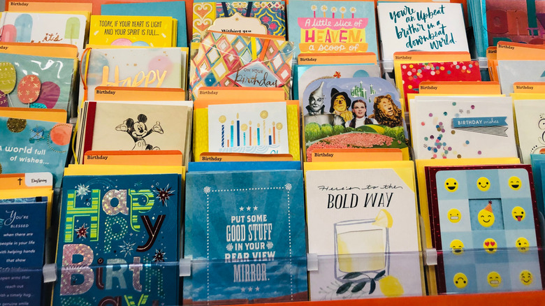 A bright and colorful display of greeting cards at a store