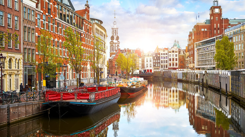 Channel in Amsterdam Netherlands. Houses and river Amstel.