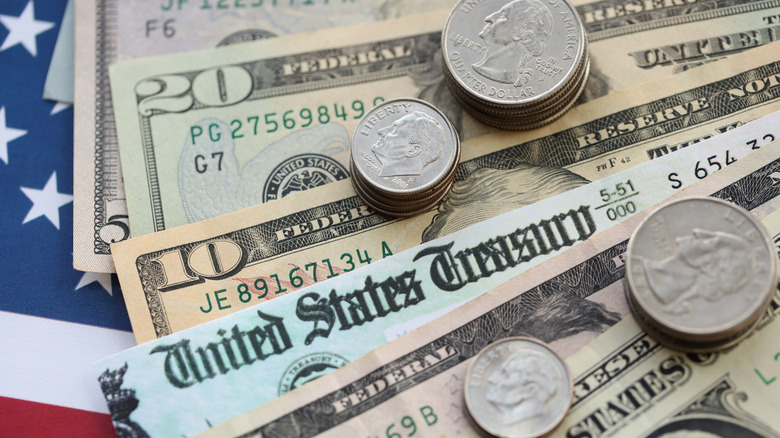 Top of a U.S. Treasury check along with currency