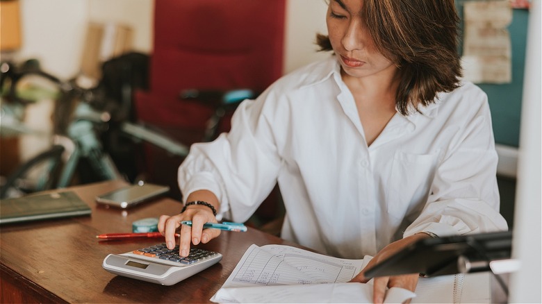 Person managing finances at home