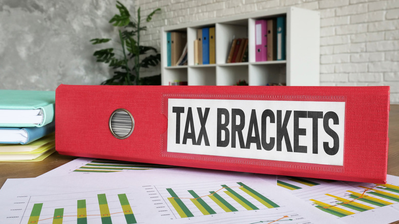 red binder labeled: tax brackets