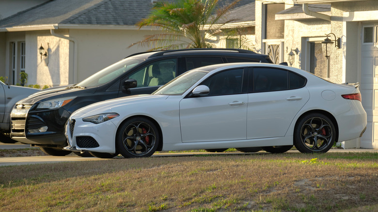 two cars parked on a driveway