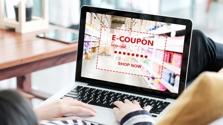 Woman looking at an e-coupon on her laptop