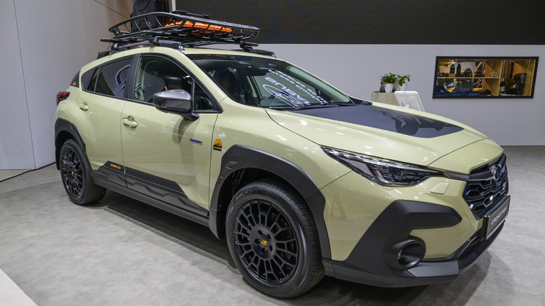 A 2026 Subuaru Crosstrek on display a car show with a mounted roof rack