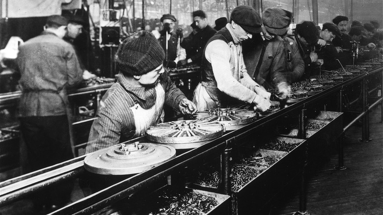 Ford workers on assembly line