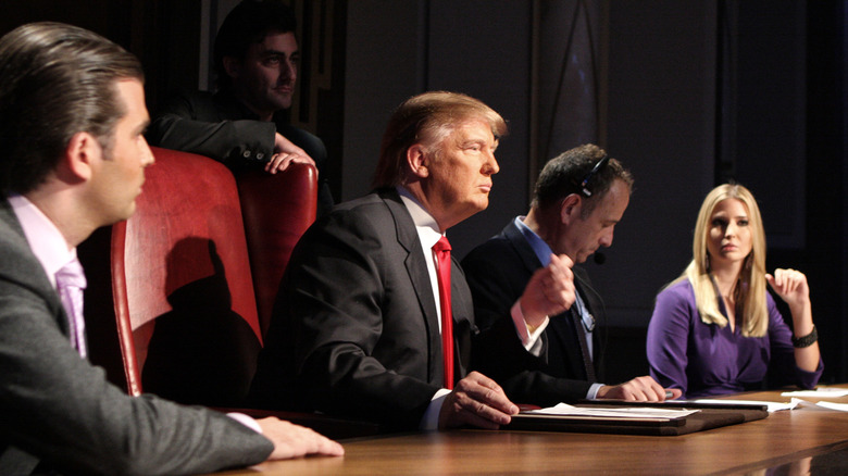 Donald Trump alongside his children and partners in an episode of "The Apprentice"