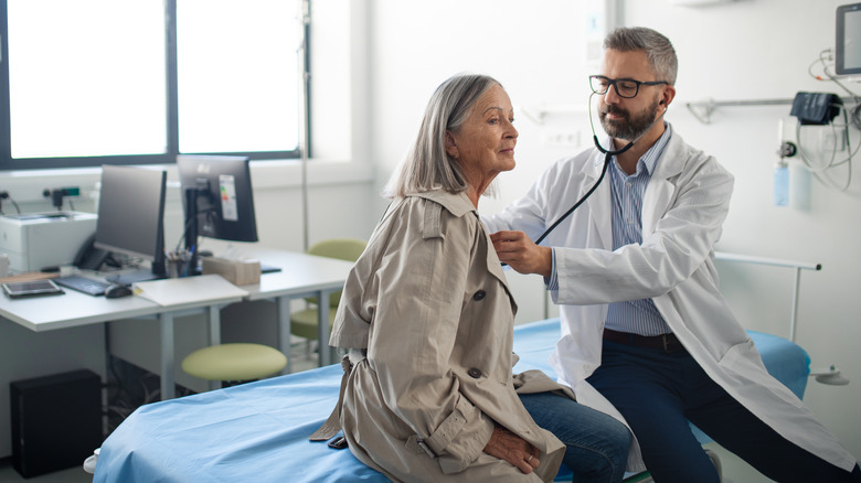 Doctor checking patient with a stethoscope