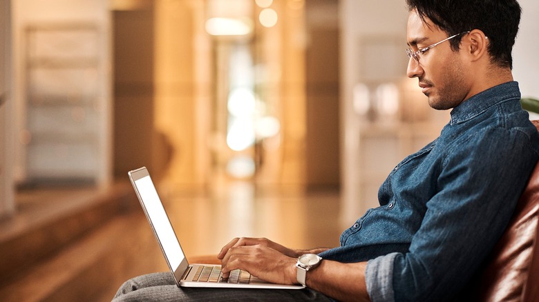 Person typing on laptop