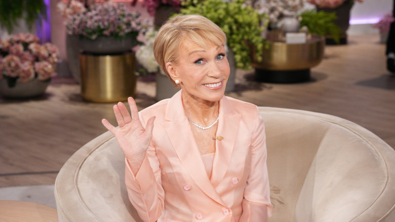 Barbara Corcoran sitting on a chair during TV appearance