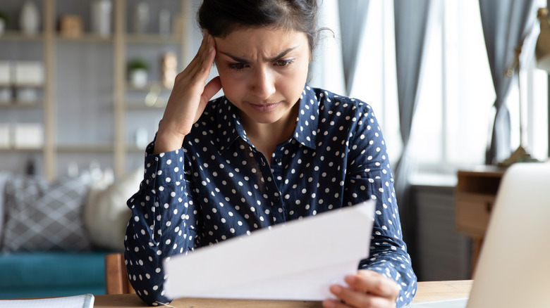 woman holding concerning letter