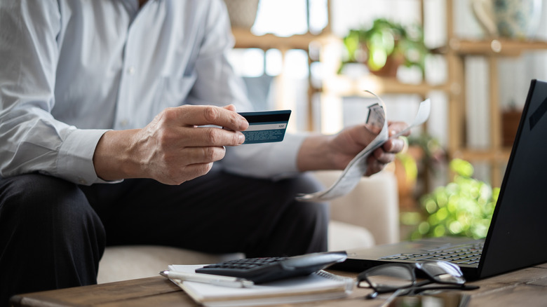 man using credit card