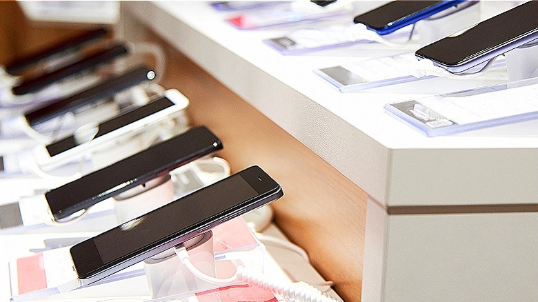 rows of smartphones in store