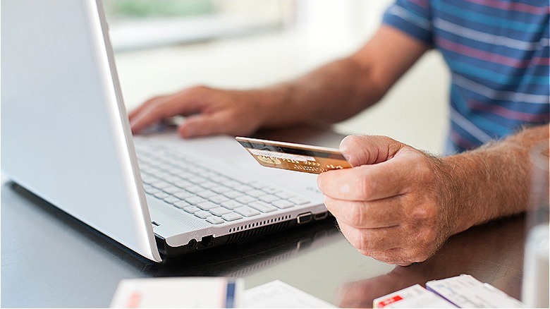 person shopping with credit card