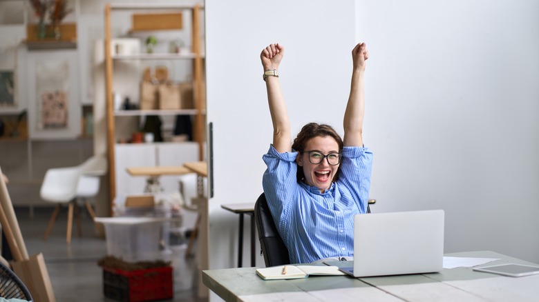 woman learning about her raise at work