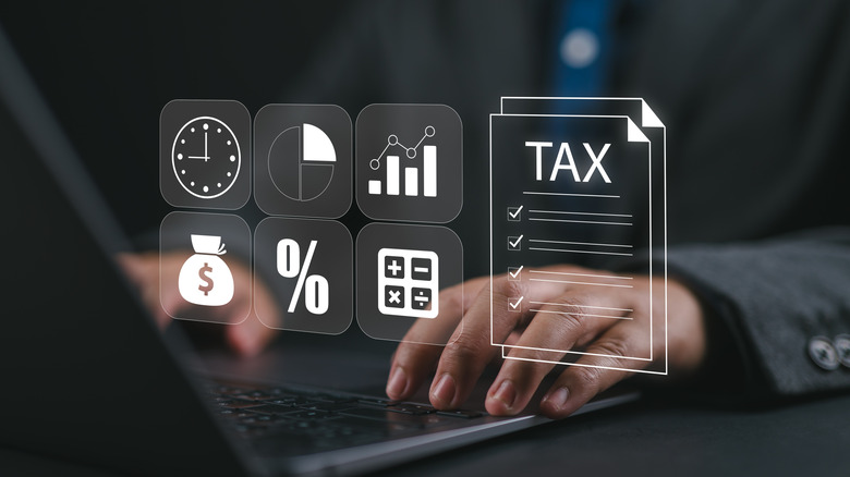 Taxpayer using laptop filling out tax forms online