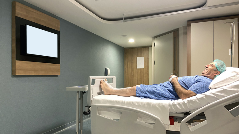 Patient watching TV in a hospital room