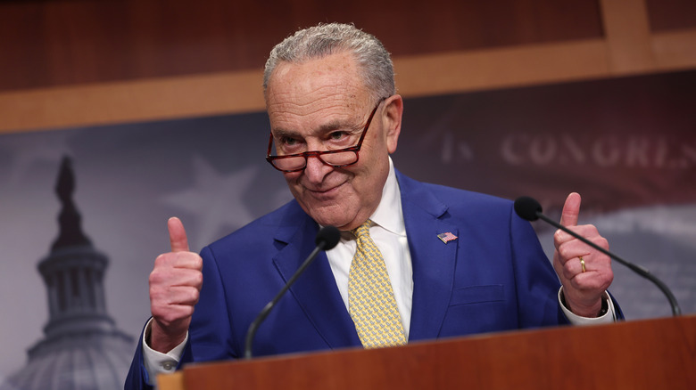 Chuck Schumer giving a thumbs up sign in the U.S. House of Representatives.