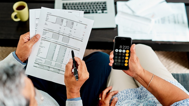 Couple calculating retirement accounts