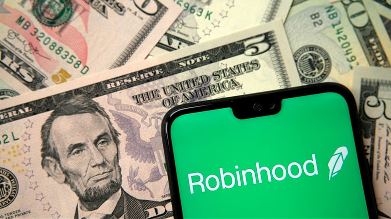 $5 bills, smartphone Robinhood app