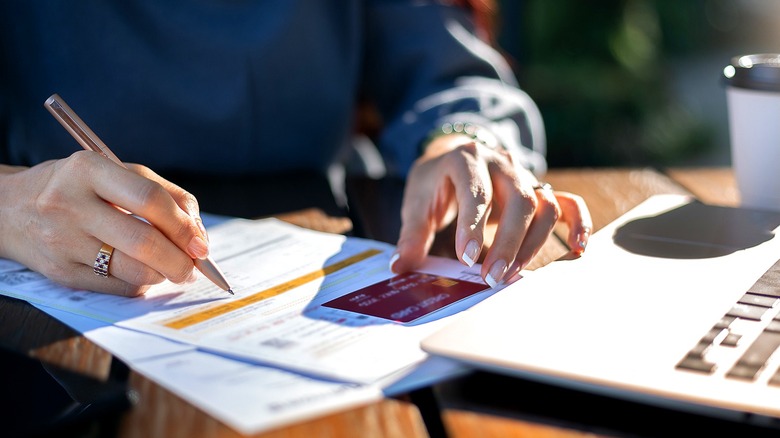Person reviewing credit card statement