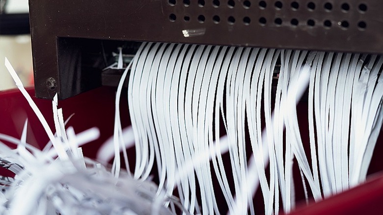 Paper coming through shredder machine