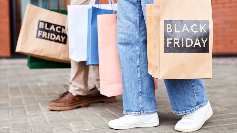 Shoppers holding Black Friday bags