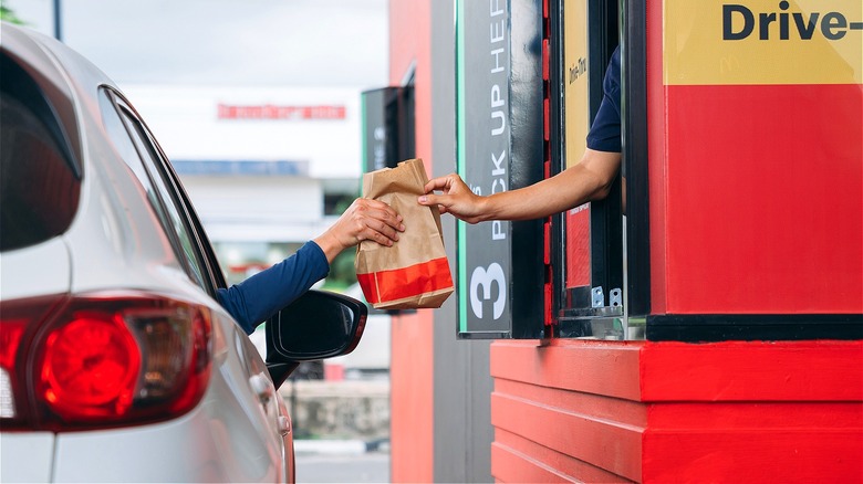 Person receiving fast-food drive-through order