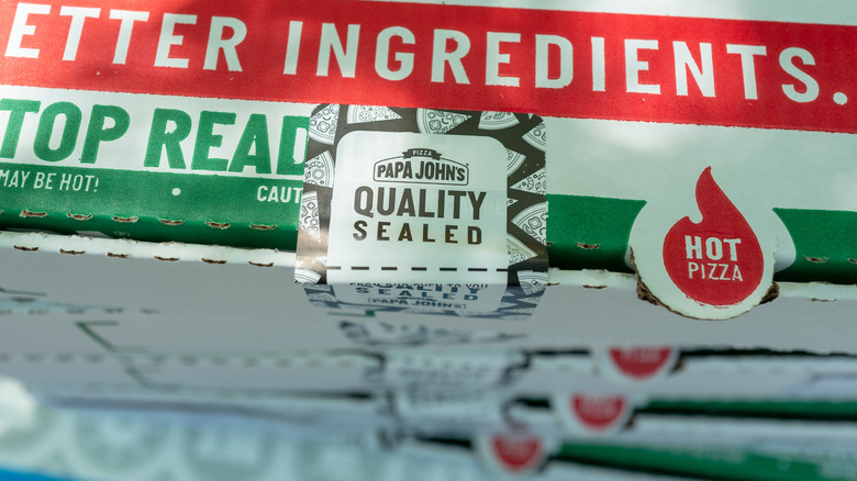 A stack of Papa Johns pizza boxes in a California in 2021.