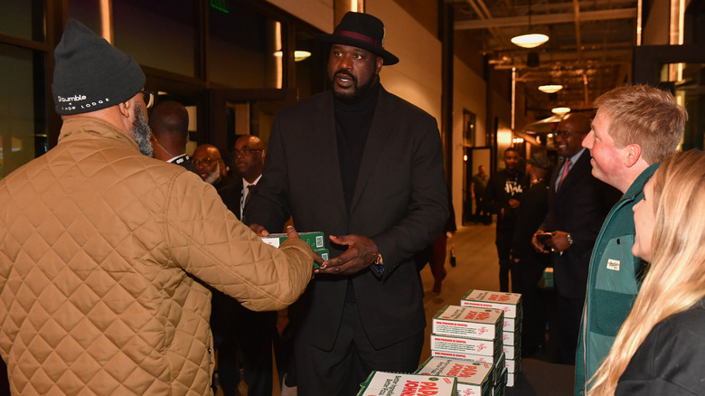 Shaquille O'Neal hands of Papa Johns pizzas in Atlanta, Georgia